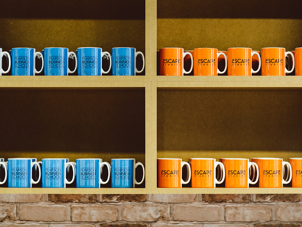 Kitchen shelves with blue and orange mugs
