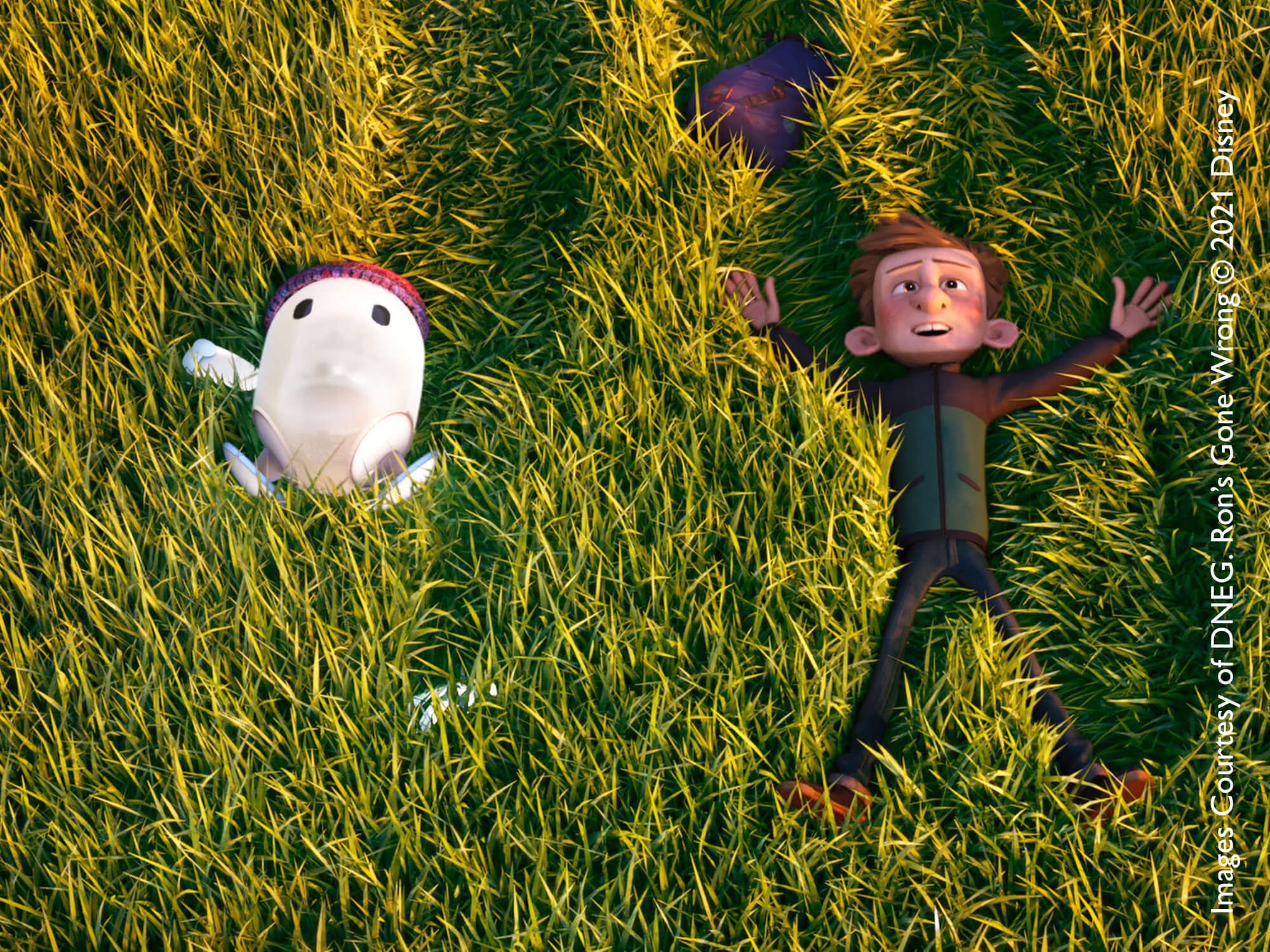 3D animated robot and boy lying in grass