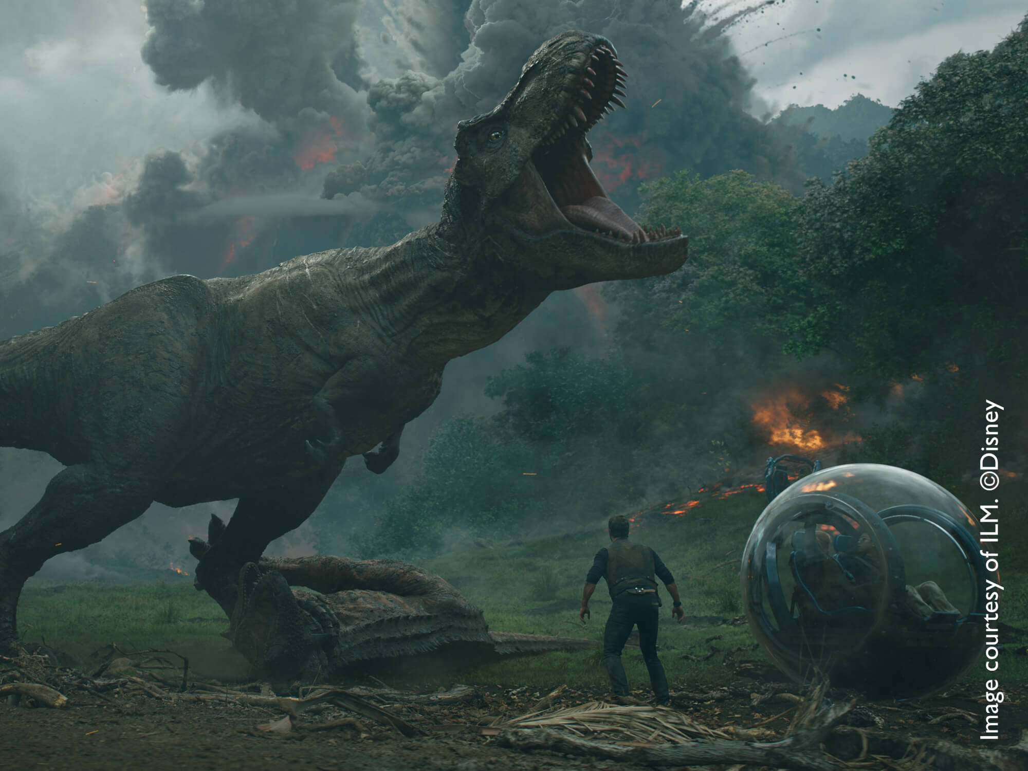 T-Rex with explosion, smoke and fire in the background from Jurassic World film